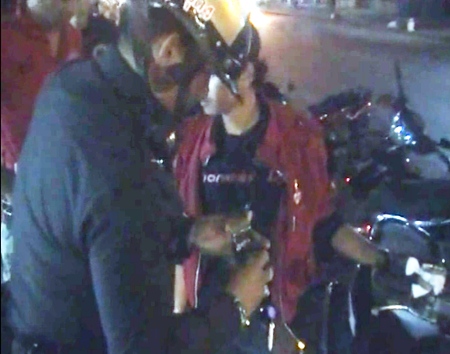 Suthat Kularb, right, is arrested following the police sting operation.